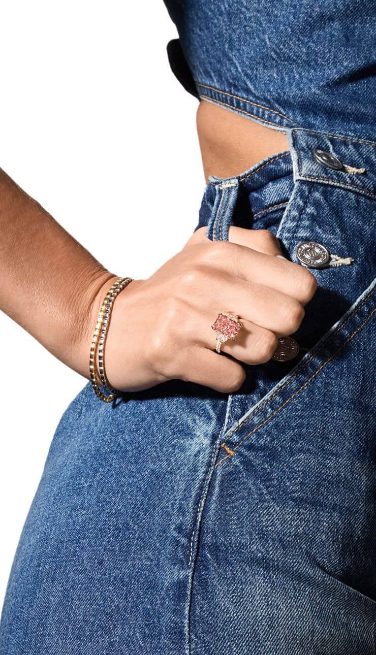 Woman showcasing Jean Dousset fancy color diamond engagement rings