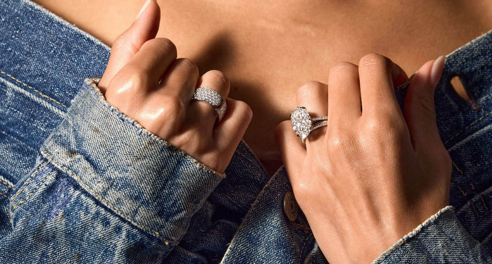 Female model hand with handcrafted ready-to-ship engagement ring by Jean Dousset