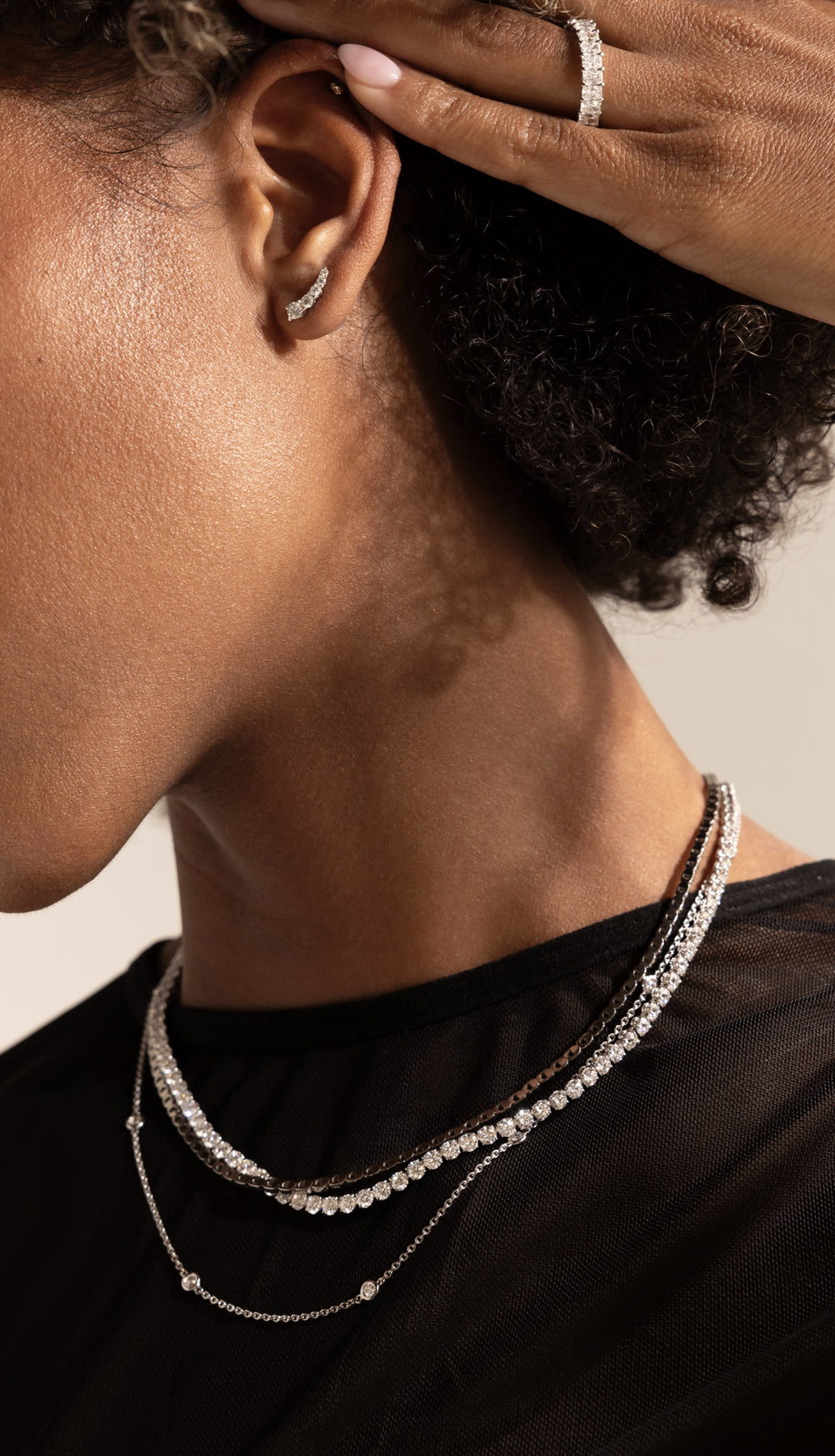 Female model showcasing Jean Dousset necklace and pendant collection with lab diamonds