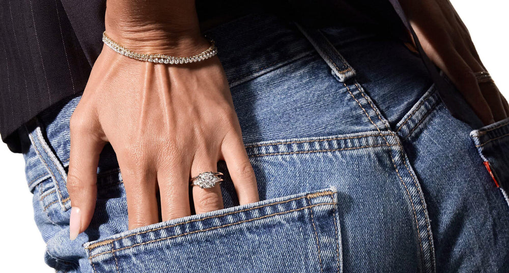 Model showcasing three-stone engagement ring by Jean Dousset